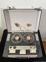 Open reel-to-reel tape recorder with two reels mounted on top, showing controls and knobs labeled Korting Constellation 88