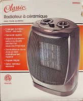Box showing product branding, heat settings, adjustable thermostat, and safety features in French and English.