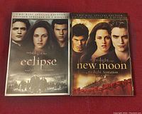 Photo of two sealed two-disc special edition Twilight Saga DVD sets: Eclipse and New Moon.