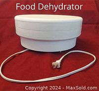 Food dehydrator showing the stacked trays and power cord