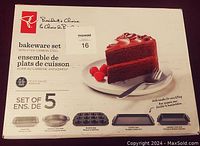 Front of packaging showing product name, brand, image of chocolate cake on plate, and bakeware set images with item names