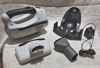 Shark 18V vacuum with detachable battery, wall mount bracket, and charger adapter.