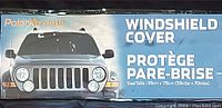 Close-up of the product packaging label showing brand Polar Xtreme, product name Windshield Cover, size 99cm x 178cm, with a truck front image.