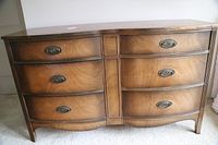 Front view of antique AMF dresser showing six drawers and vintage oval metal handles