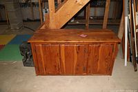Bench height cedar cupboard closed, showing wood grain and construction.
