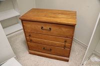 Maple 3 drawer chest of drawers showing full front and side view.