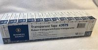 Box of 12 rolls of Business Source transparent tape, showing brand, item number 43575, and tape size specifications.