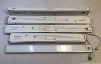 Five FanpBow motion sensor strip lights with original boxes, four 40cm length and one 30cm length, showing slight box damage and USB charging cables.