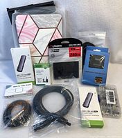 Photo of the full lot showing Kingston SSD, cases, adapters, cables, and connectors.