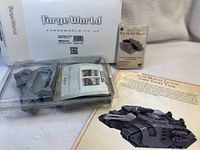 Image showing the plastic parts of the new Forge World Space Marine Legion Sabre Strike Tank model kit in a clear tray, with instruction sheets and packaging.