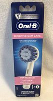 Front view of Oral-B Sensitive Gum Care replacement brush heads pack showing title, brand, image of brush head and quantity.