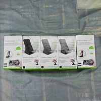 Front view of the 5 boxed wireless charger stands with built-in Wi-Fi cameras.