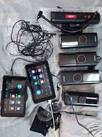 All items laid out showing tire inflators, GPS panels, cables, suction mounts, and pouches