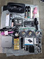 Top view showing karaoke speaker, microphones, amplifier, mixer, mini mixer board, cables and accessories