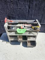 Tool caddy overall with various tools on top and drawers, showing lot layout and condition