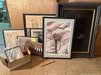 Overall group shot showing all framed art, documents, wood plaques and box with small prints