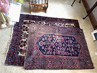 Both rugs stacked showing size and pattern differences