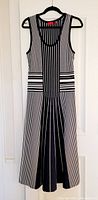 Front view of navy blue and white sleeveless dress with vertical stripes and textured horizontal striped midsection.