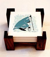 Set of four Inuit-themed painted tile coasters stacked in a dark wooden holder showing full lot together