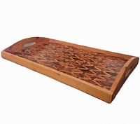 Angled view of the rectangular wooden serving tray showing the warm natural wood finish and raised sides with handles.