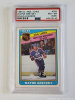 Front view of 1984 O-Pee-Chee Wayne Gretzky Goal Leader hockey card in PSA graded slab showing the player skating in Edmonton Oilers uniform.