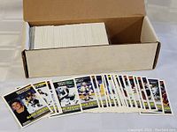 Box of hockey cards with front row of cards displayed, showing players including Mario Lemieux and others.