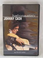 Front cover of the DVD case showing Johnny Cash playing guitar with title and Austin City Limits logo.
