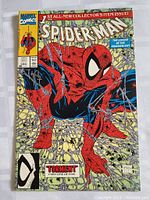 Front cover of Marvel Comics Spider-Man #1 showing Spider-Man crouching, with Todd McFarlane’s signature visible.