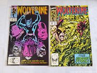 Photo showing two vintage Wolverine comic books side by side with clear cover art.
