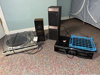 Overview of all audio components on carpeted floor