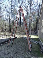 A-frame view of ladder standing outdoors