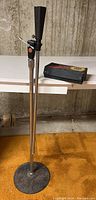 Photo of the microphone stand with the Sunn M400 microphone attached, showing the whole stand and microphone.