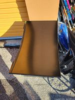 Full view of monitor face-up showing curvature and attached stand