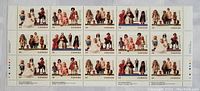 Full view of the stamp sheet block showing all 20 stamps depicting pairs of traditional dolls in various ethnic costumes