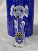 Full view of Bohemia crystal dog figurine with original sticker visible on the front.
