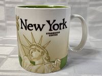 Starbucks New York Collector Series mug showing the Statue of Liberty design and text.