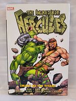 Front cover of the hardcover graphic novel 'The Incredible Hercules' by Marvel Comics showing Hercules fighting the Hulk.