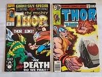 Photo showing two vintage Marvel comic books: The Mighty Thor issue #231 with Thor holding his hammer and Giant-Size Special issue #432 with Thor and Loki fighting.