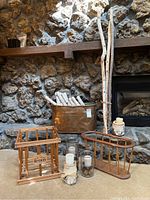 Overview of lot showing large copper vessel, wood magazine holders, candle holders, decorative Aspen wood sticks, and wooden crate.