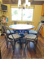 Front view of full dining set in kitchen against window backdrop