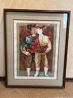 Full front view of framed lithograph against wall