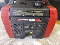 Front-top view showing fuel cap on top, model decal "SPORT 1850+" on front