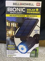 Box front of Bell+Howell Bionic Spotlight showing solar powered, motion activated, no batteries or wires, with 8 super bright LED lights and weather resistant features