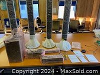 Overview of 9-piece Sony S Air audio system with speakers, cables, and manuals on a wood table.