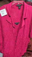 Front of fuchsia Connected Woman dress and jacket set showing textured pattern and collar of jacket