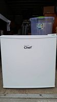 Front view of white Master Chef mini fridge with no visible damage, showing the logo on the door.