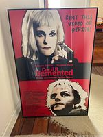 Full view of the framed movie poster showing main design and text.