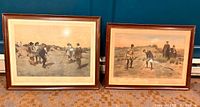 Two vintage golfing prints, matted and framed in dark wood frames, shown side by side on floor