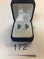 Pair of opal stud earrings in presentation box, showing overall appearance