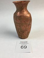 Front and angled side view of the medium oval copper vase showing the hammered texture and patina.